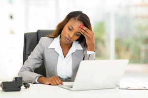 Woman working on her laptop: Inglewood Women's Planning