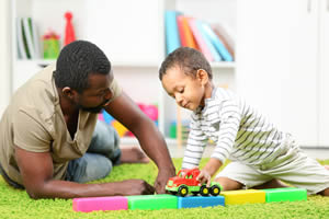 Man playing with his son; Special Needs Planning in Inglewood