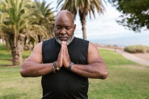 How to Leave an Inheritance Without Creating Conflict, image of man in namaste posture